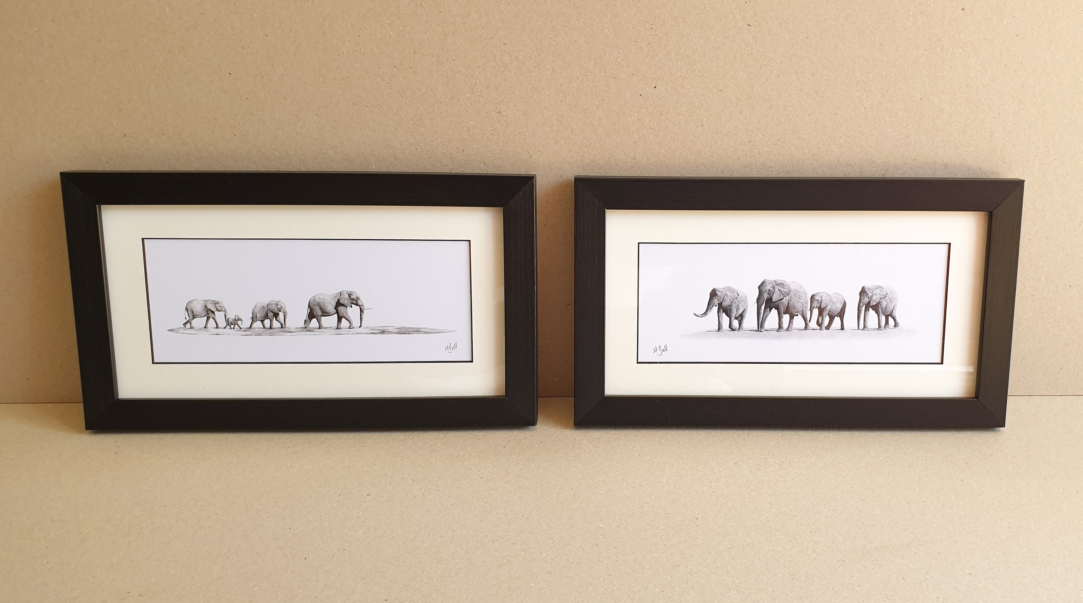 Elephant herd drawings with a frame by Matthew Bell