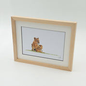 African lioness with a cub framed artwork with natural wood frame