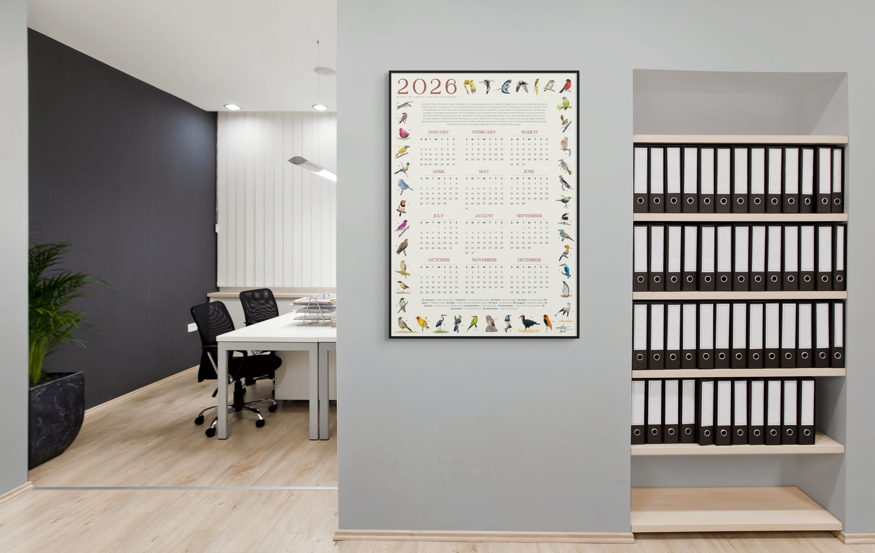 2026 South African bird calendar poster featuring hand-drawn illustrations of 40 native bird species surrounding a clean, minimalist yearly calendar layout on an A2 sheet2026 Suid-Afrikaanse voëlkalender-plakkaat met handgetekende illustrasies van 40 inheemse voëlspesies rondom ’n netjiese, minimalistiese jaarlikse kalenderuitleg op ’n A2-vel