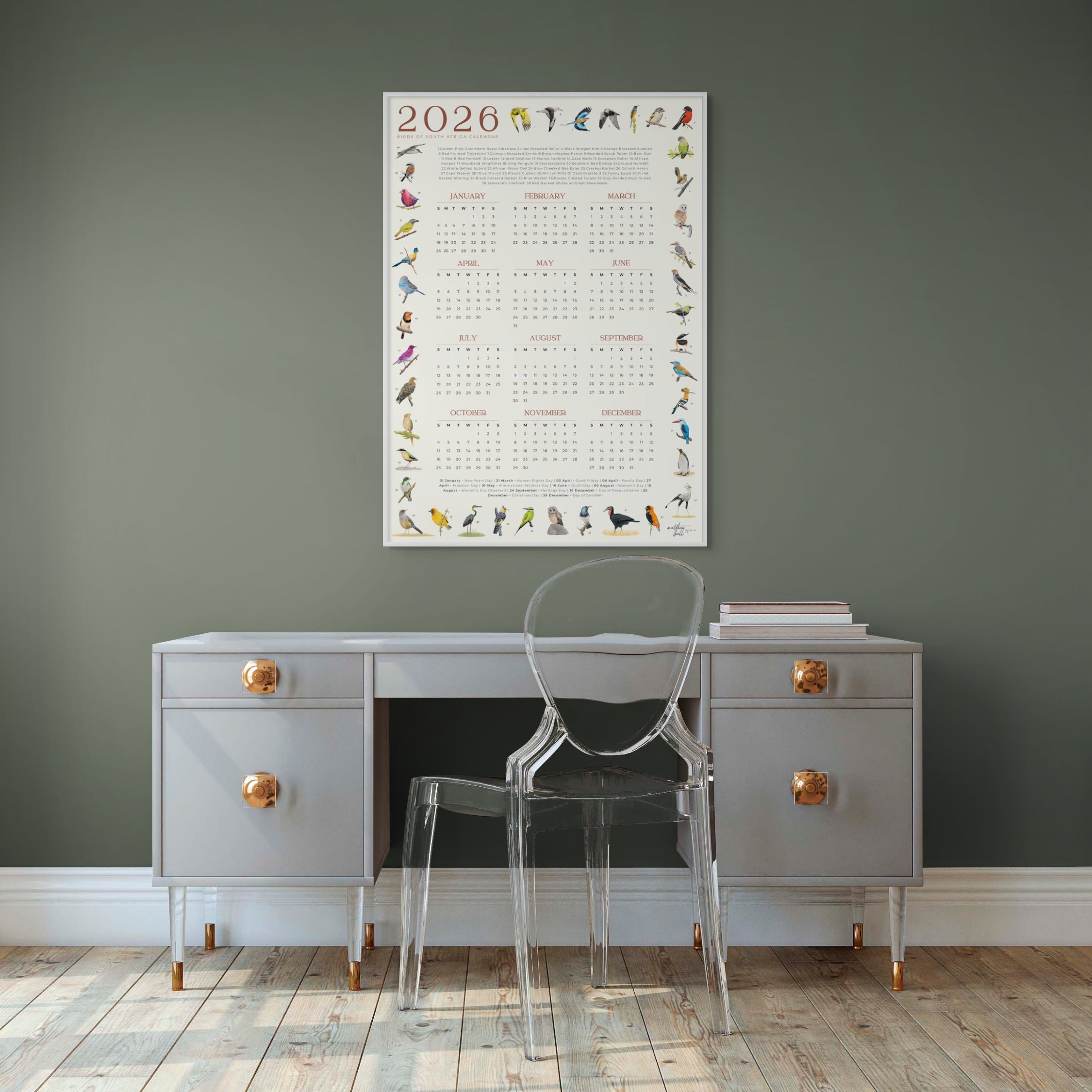 2026 South African bird calendar poster featuring hand-drawn illustrations of 40 native bird species surrounding a clean, minimalist yearly calendar layout on an A2 sheet2026 Suid-Afrikaanse voëlkalender-plakkaat met handgetekende illustrasies van 40 inheemse voëlspesies rondom ’n netjiese, minimalistiese jaarlikse kalenderuitleg op ’n A2-vel