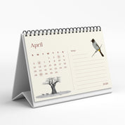 Tabletop calendar for April 2020 with a tree and bird illustration on a white background