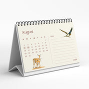 Desk calendar for August 2020 with illustrations of a deer and a bird on a white background
