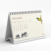 Desk calendar for December 2020 with illustrations of elephants and a bird on a white background