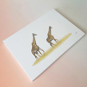 A pair of giraffes walking in the Serengeti artwork print on stretched canvas