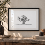 African Baobab Tree artwork with a black frame hanging on the wall