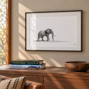 African elephant framed artwork with a black frame hanging on the wall