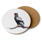Wooden coaster with an artwork of a bateleur on it