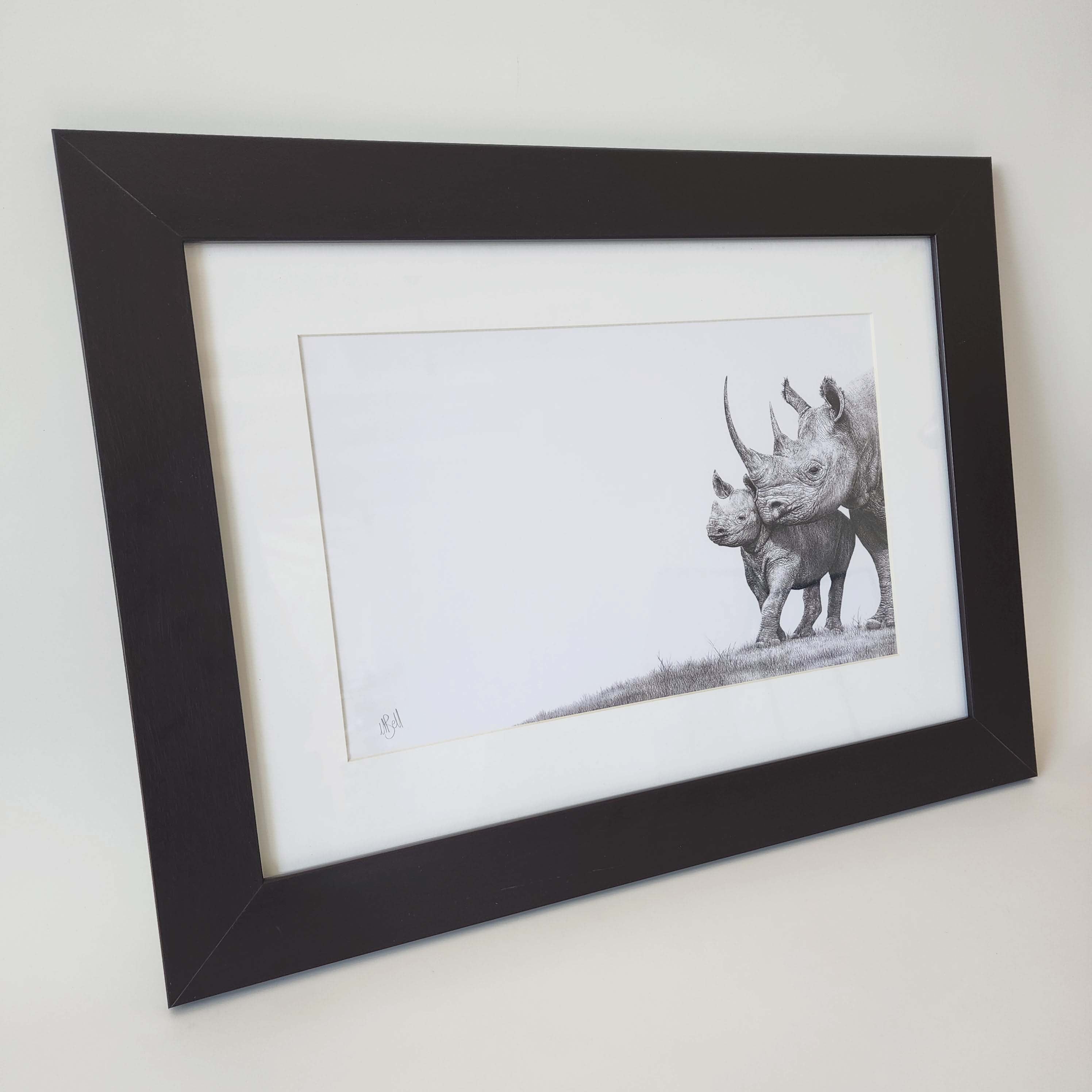 African Black Rhino mother and calf pencil artwork with a brown wooden frame