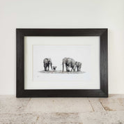 African elephants family artwork with a brown frame