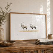 Pencil artwork of two Gemsbk wandering through the desert standing on a sideboard in a beautiful home