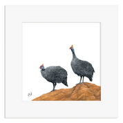 Framed artwork of two guinea fowl on a white background
